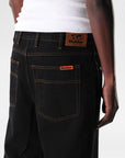 Butter relaxed denim jeans in washed black, full-length pants with a casual fit