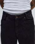 Black denim pants from FORMER AG DENIM PANT collection, featuring classic fit and stitching details.