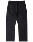 Black denim pants by Former AG, featuring a classic fit and stylish design, shown on a model.