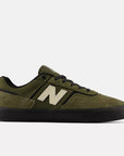 New Balance 306 Jamie Foy shoes in dark moss and black with a sleek design and sporty silhouette.