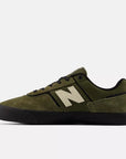 New Balance 306 Jamie Foy shoes in dark moss and black color, featuring a sleek athletic design and durable construction.