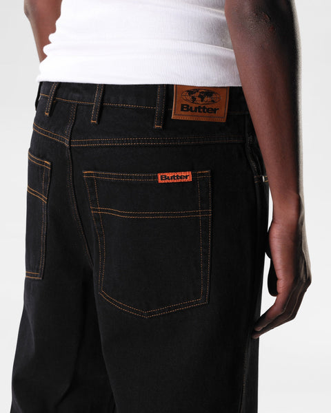 Butter relaxed denim jeans in washed black, full-length pants with a casual fit