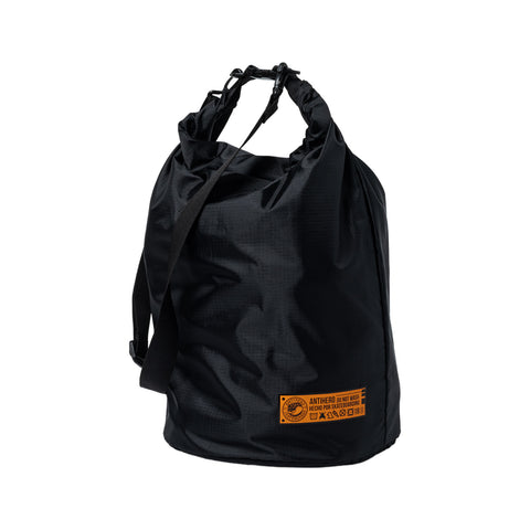 ANTI-HERO Hecho Por Skate dry bag in black with orange details and drawstring closure