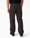 Dickies worn-in carpenter duck pants in dark brown, featuring durable fabric and classic workwear design.