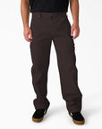 Dark brown Dickies Worn In Carpenter Duck Pants, durable work pants with reinforced stitching and multiple pockets, displayed on a mannequin.