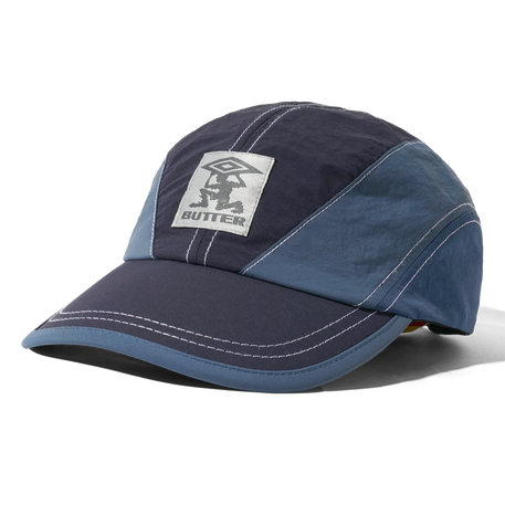 BUTTER Diamond Terrain Cap in navy and slate with structured crown and curved brim