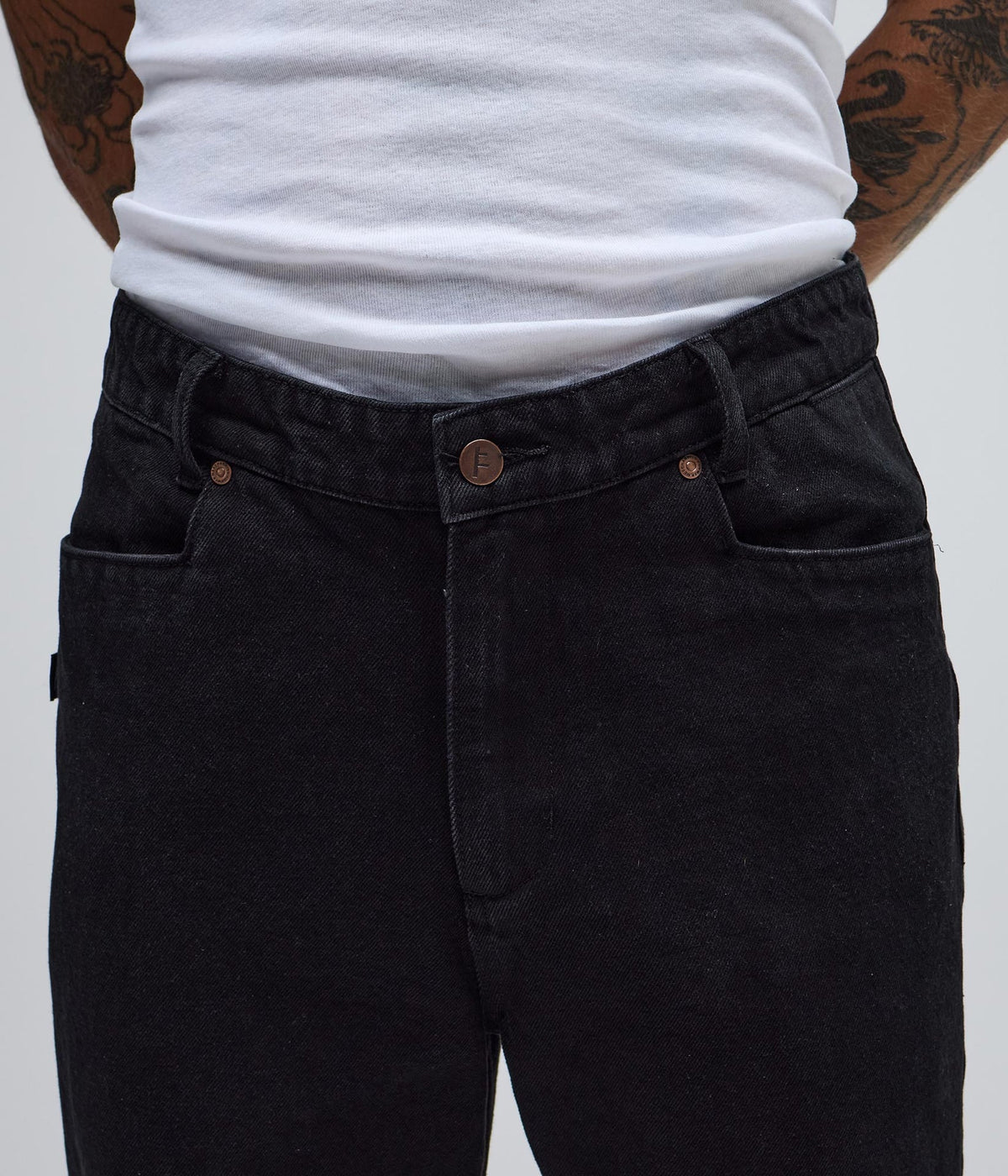 Black denim pants from FORMER AG DENIM PANT collection, featuring classic fit and stitching details.