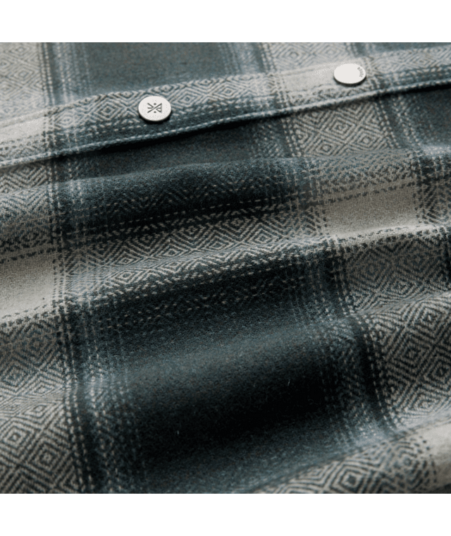 ROARK Nordsman 2.0 button-up shirt in dark slate, showing the front design and button closure