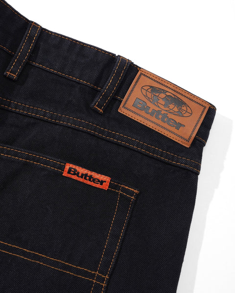 BUTTER relaxed denim jeans in washed black, shown in a relaxed-fit pants style